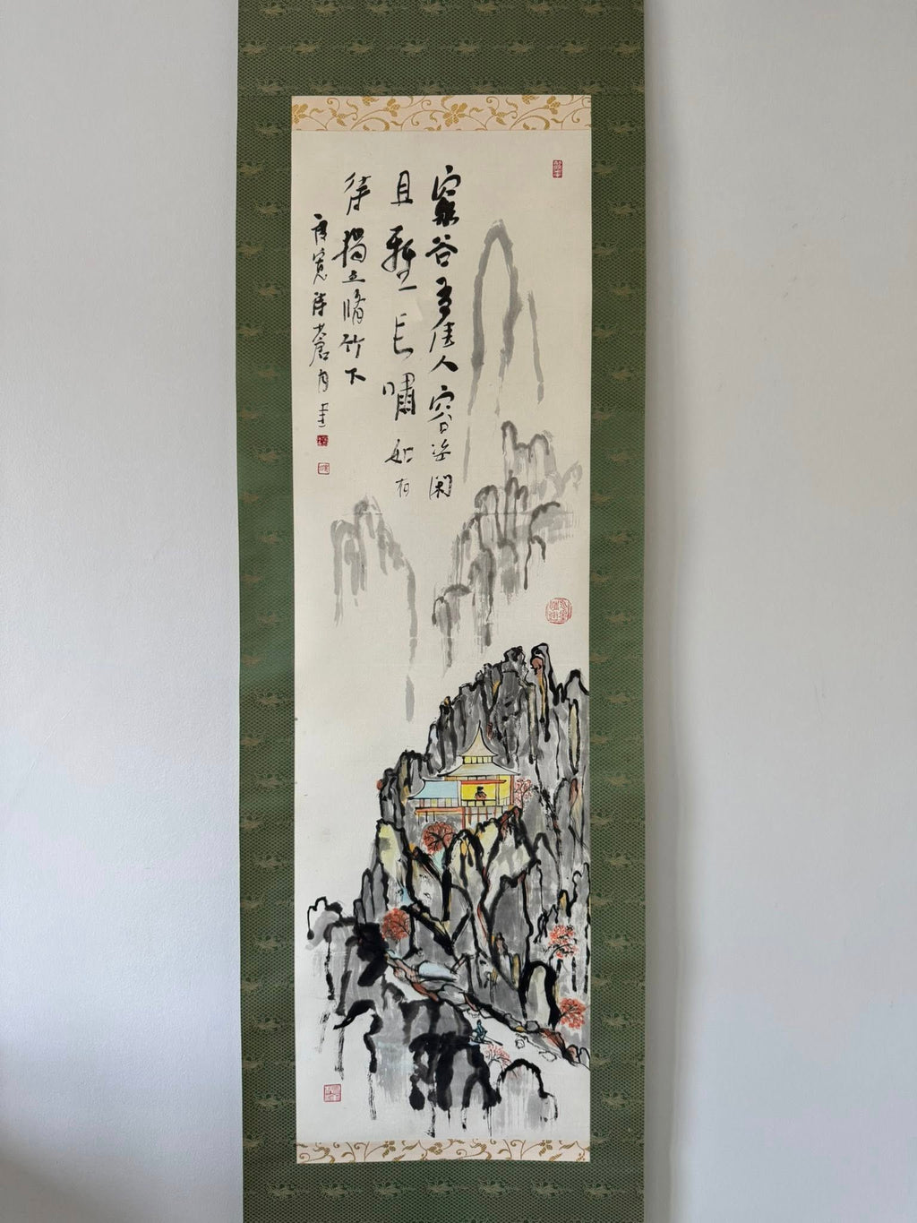 Traditional landscape painting with calligraphy on a white background