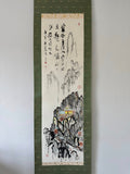 Traditional landscape painting with calligraphy on a white background